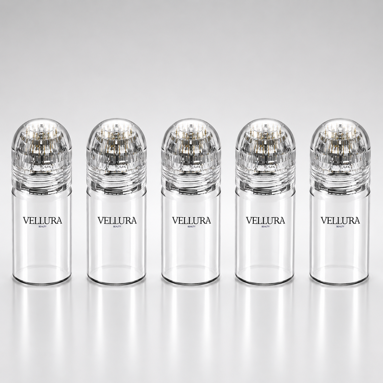 Five Vellura bottles with clear caps on a white background