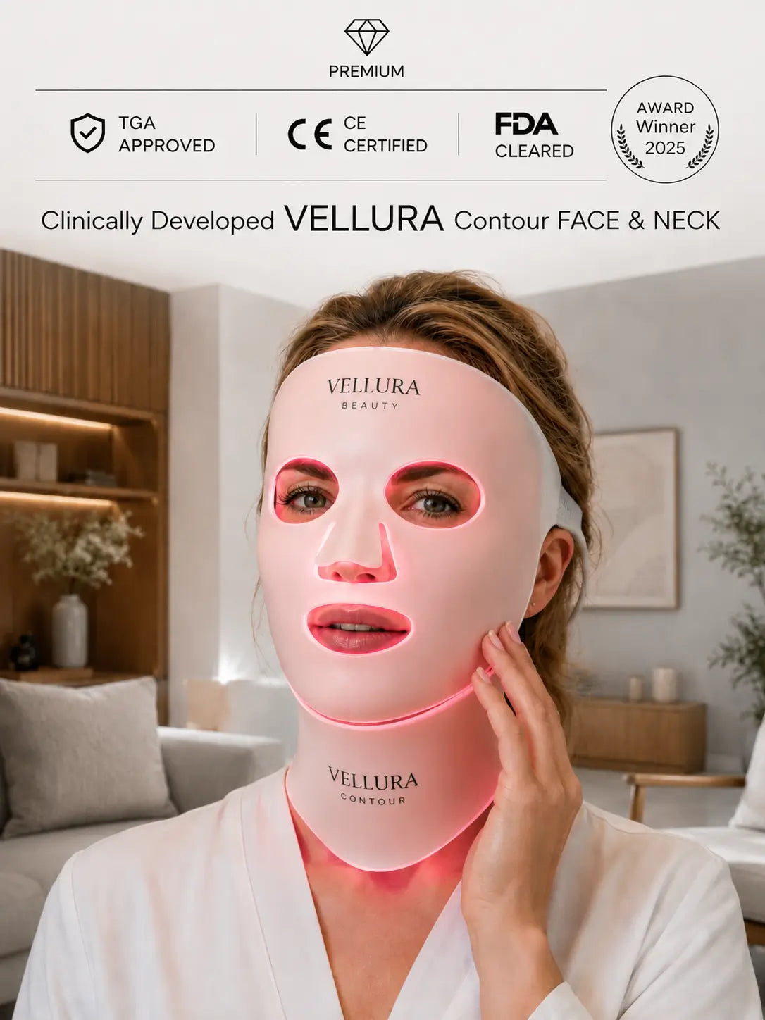A woman wearing a glowing pink Vellura Contour Face & Neck mask in a bright, modern living room setting. The image includes marketing badges at the top for TGA Approved, CE Certified, FDA Cleared, and Award Winner 2025.