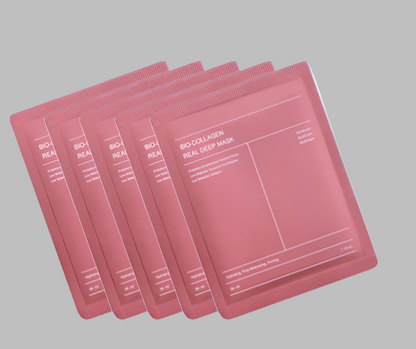 Set of pink bio-collagen face masks on a white background