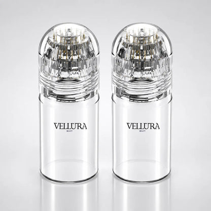 Two clear Vellura beauty products on a light gray background