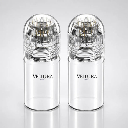 Two clear Vellura beauty products on a light gray background